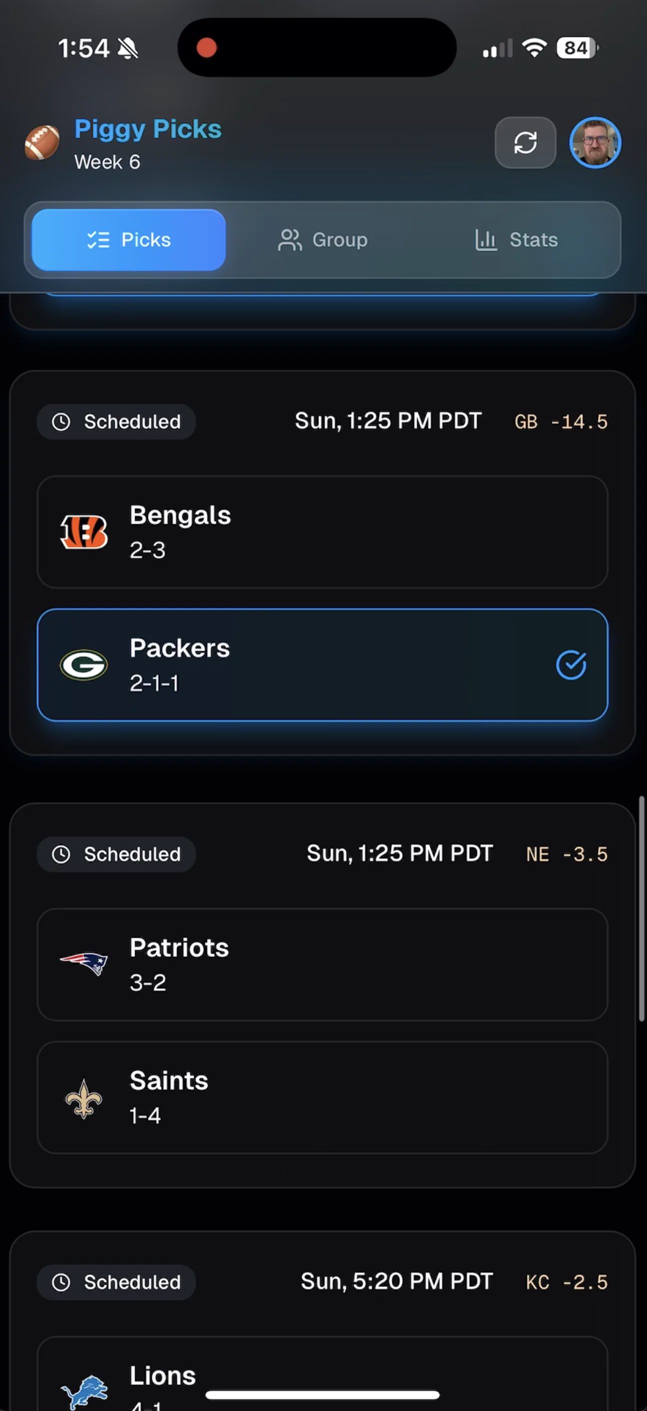 Piggy Picks mobile week picks view captured live, showing scheduled NFL games (Bengals/Packers, Patriots/Saints, Lions) with spread lines
